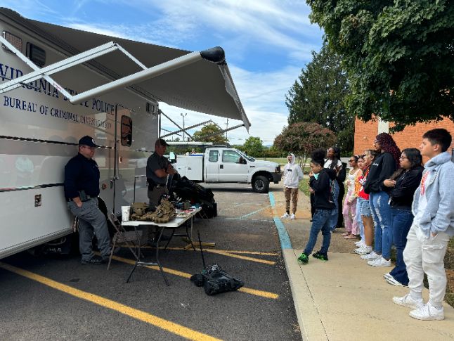  Students watching a demonstration by the Virginia State Police