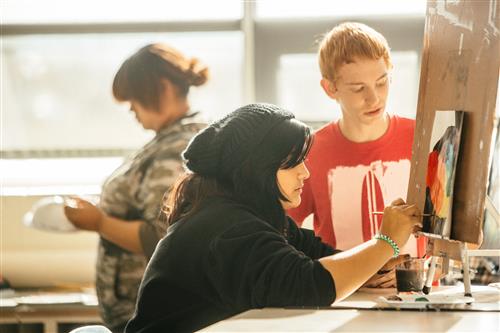 Students working in art class.